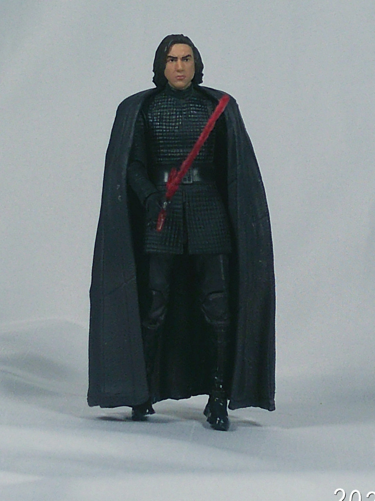 Kylo Ren figure with cape and crossguard saber