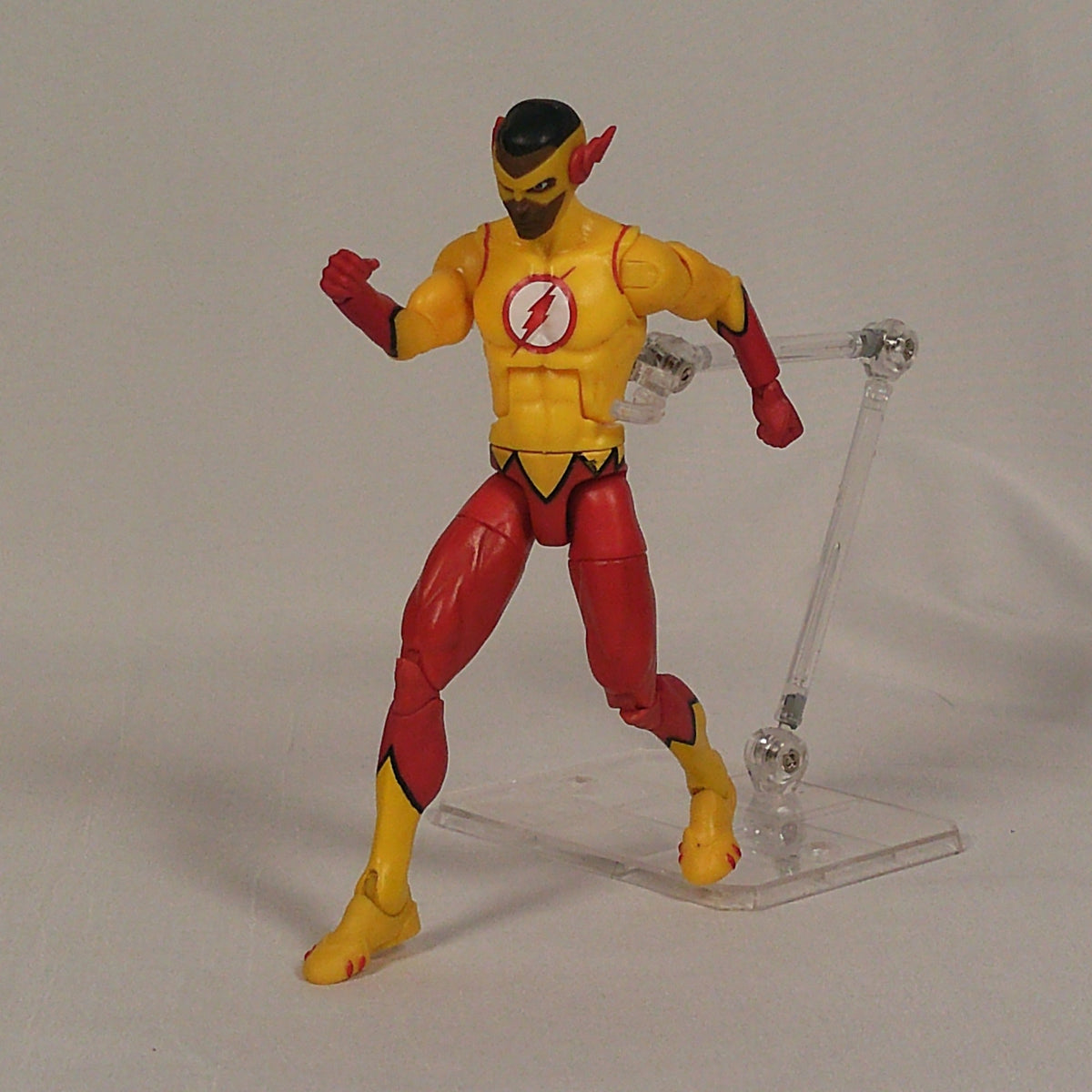 Kid Flash DC Multiverse figure on display stand, front view
