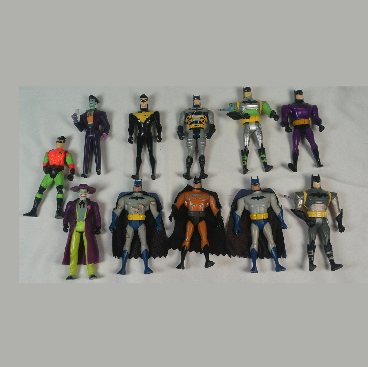 Eleven loose Batman: The Animated Series and New Batman Adventures figures laid out together