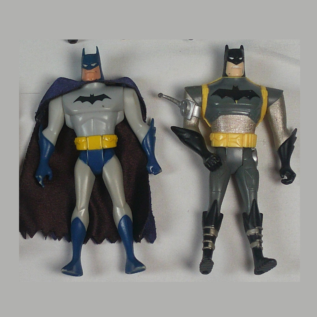 Two animated-series Batman figures, front view