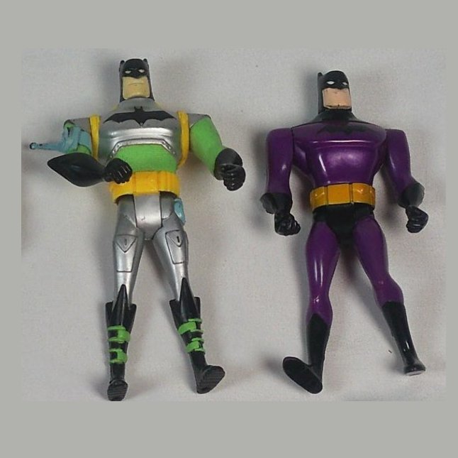 Armored Batman variant and purple-suit Batman from the lot