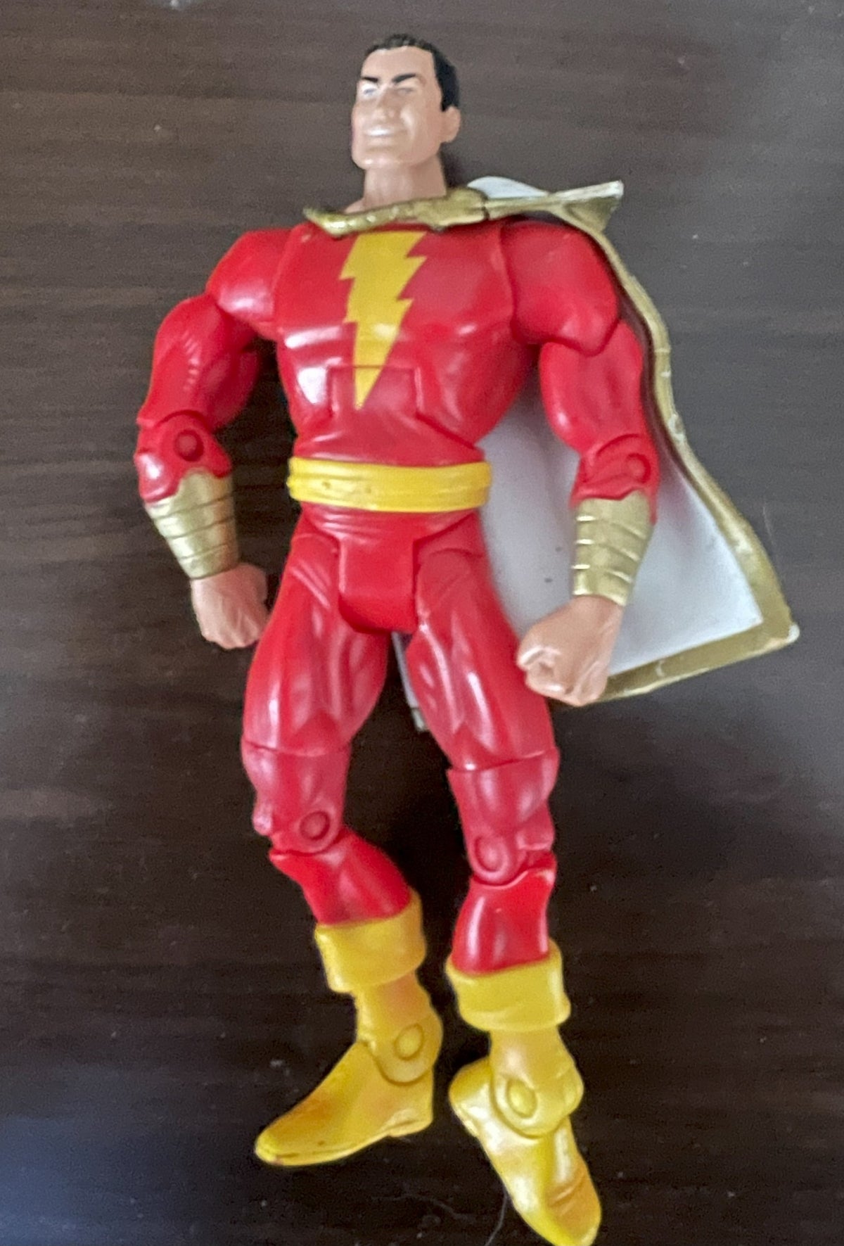 Shazam figure, rear view showing white and gold cape